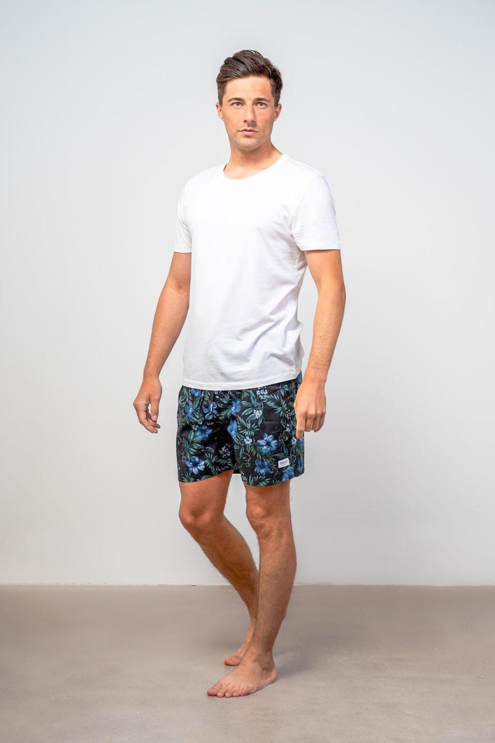 Model wearing luxury Drift Sleepwear pyjama mens dark floral sleepwear shorts