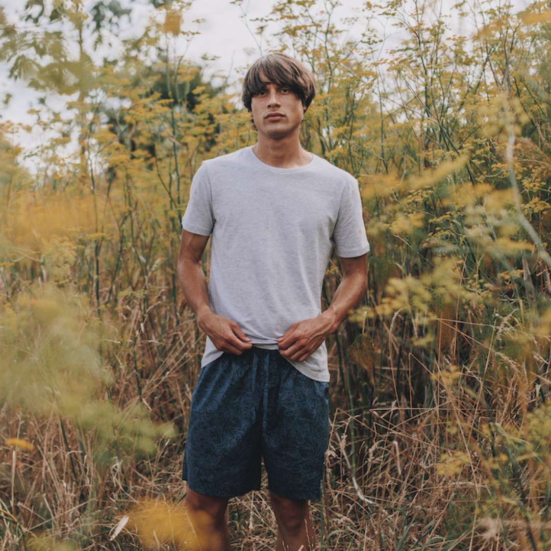 Model wearing mens pyjama shorts in midnight garden print