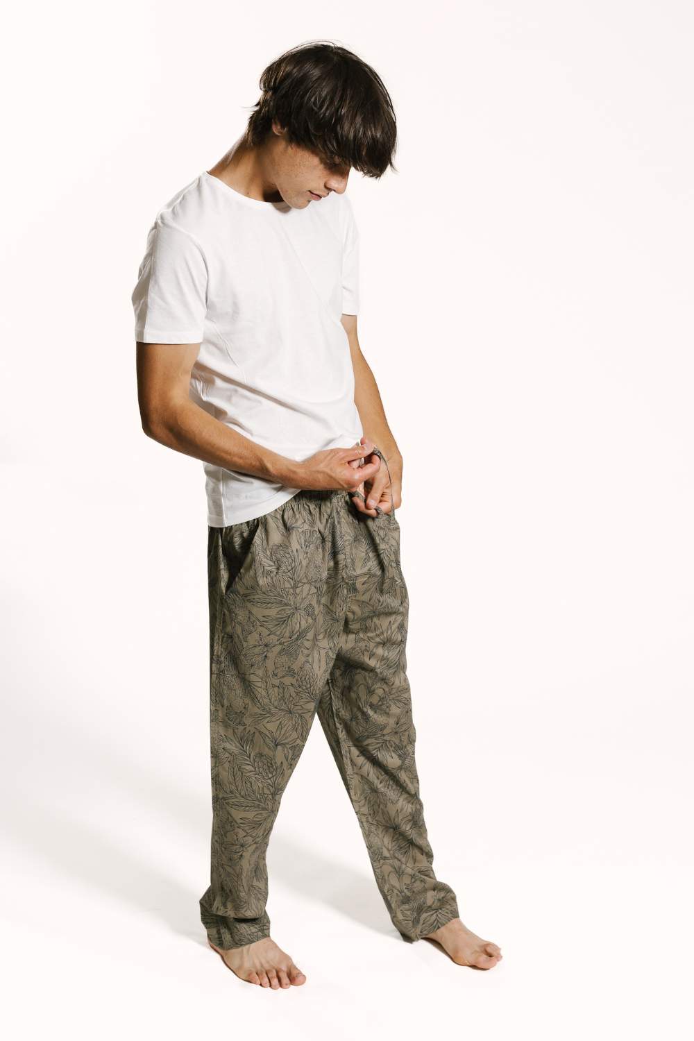 Model wearing dark sandy beige premium cotton mens pyjama bottoms