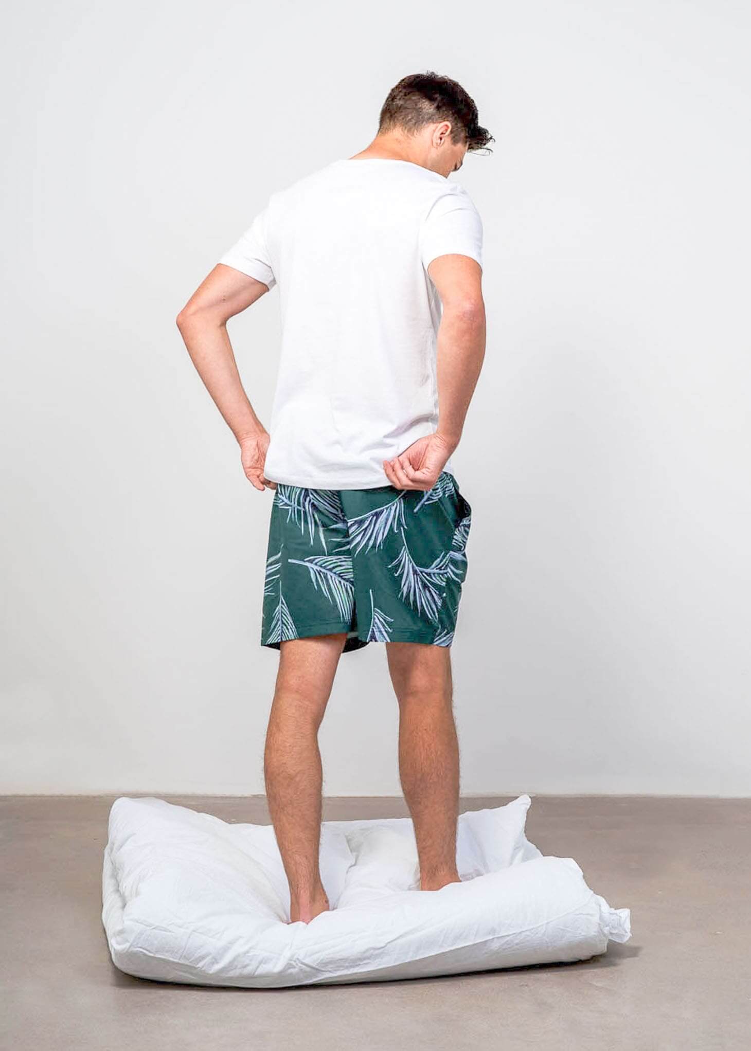 Back shot of model wearing luxury mens sleepwear