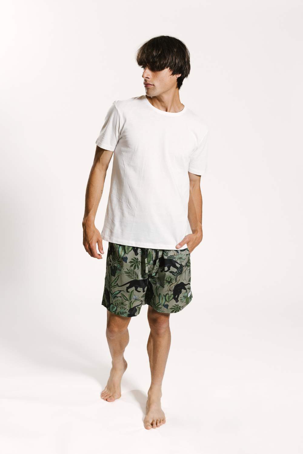 Model wearing mens organic cotton pyjama shorts with a white cotton tee