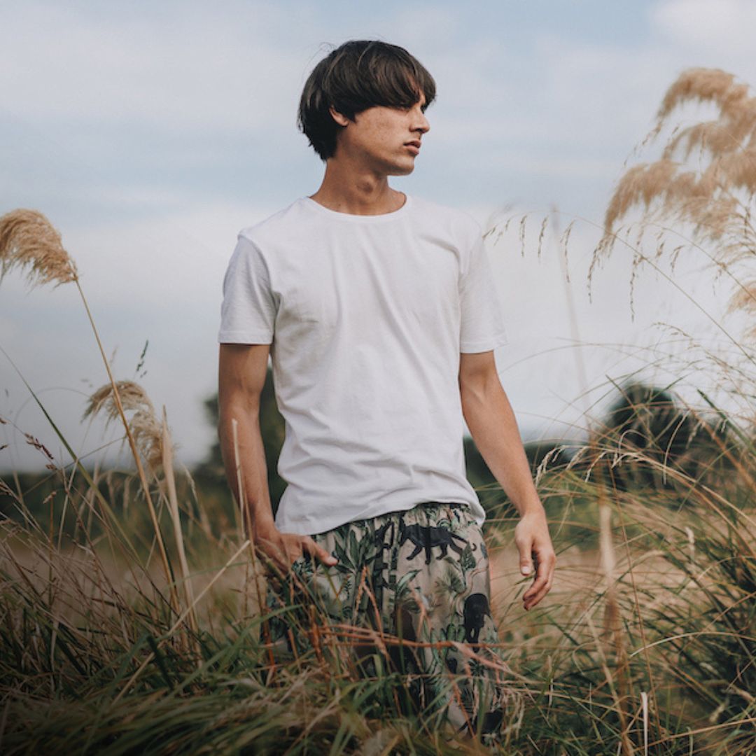 Person standing on a field in premium mens sleepwear