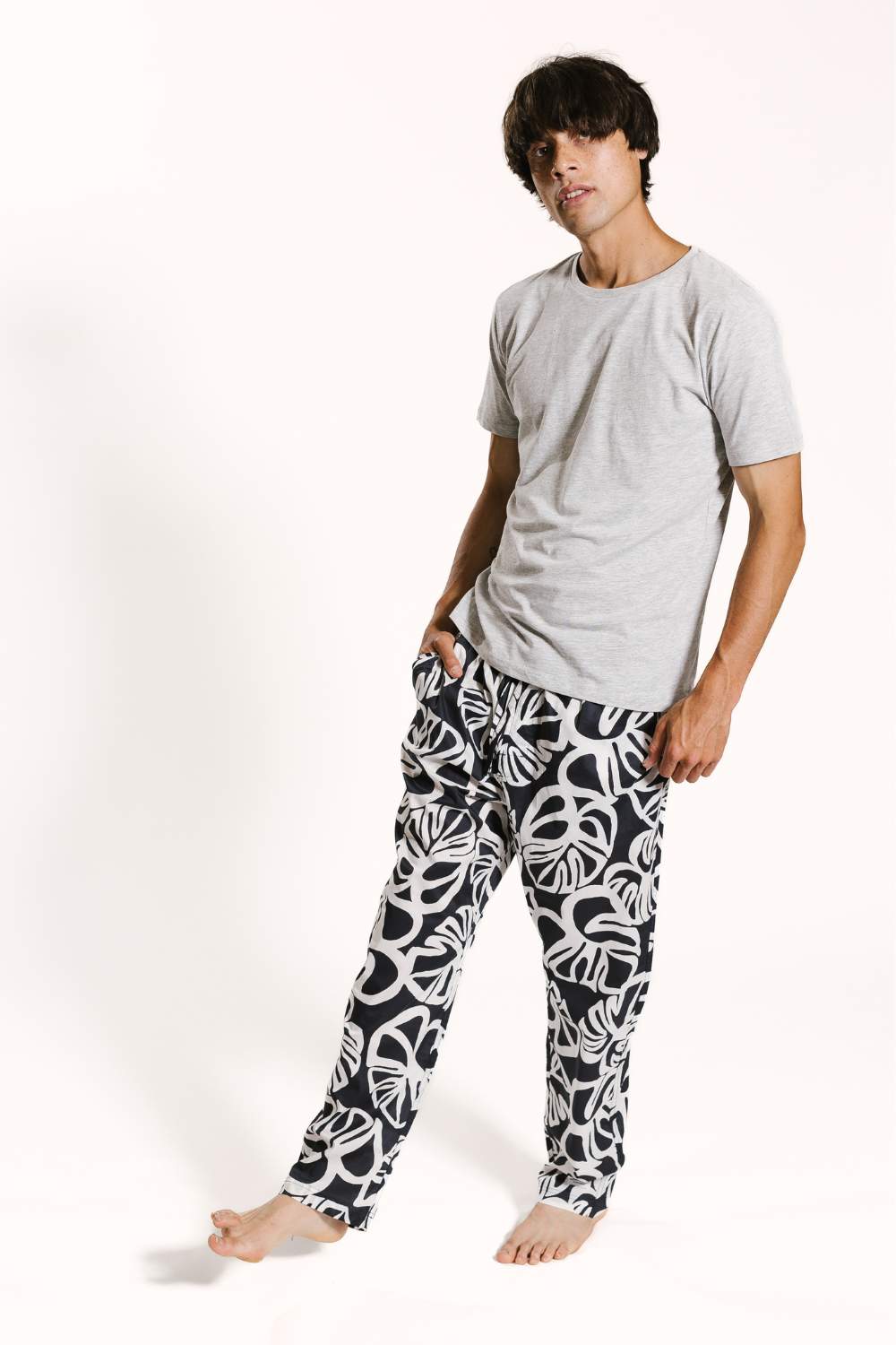 Model wearing mens cotton pyjama bottoms set by Drift Sleepwear