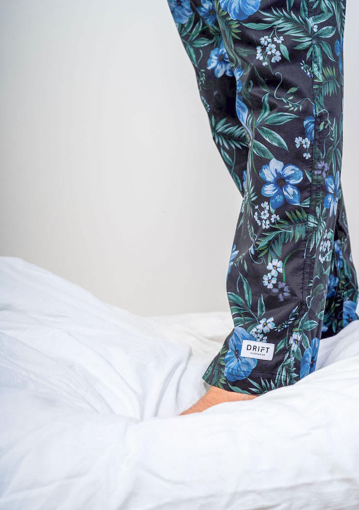 Close up men's dark floral printed pyjama bottoms